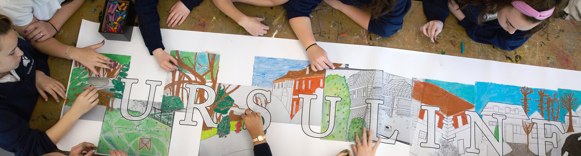 areal view of students creating a handmade art banner