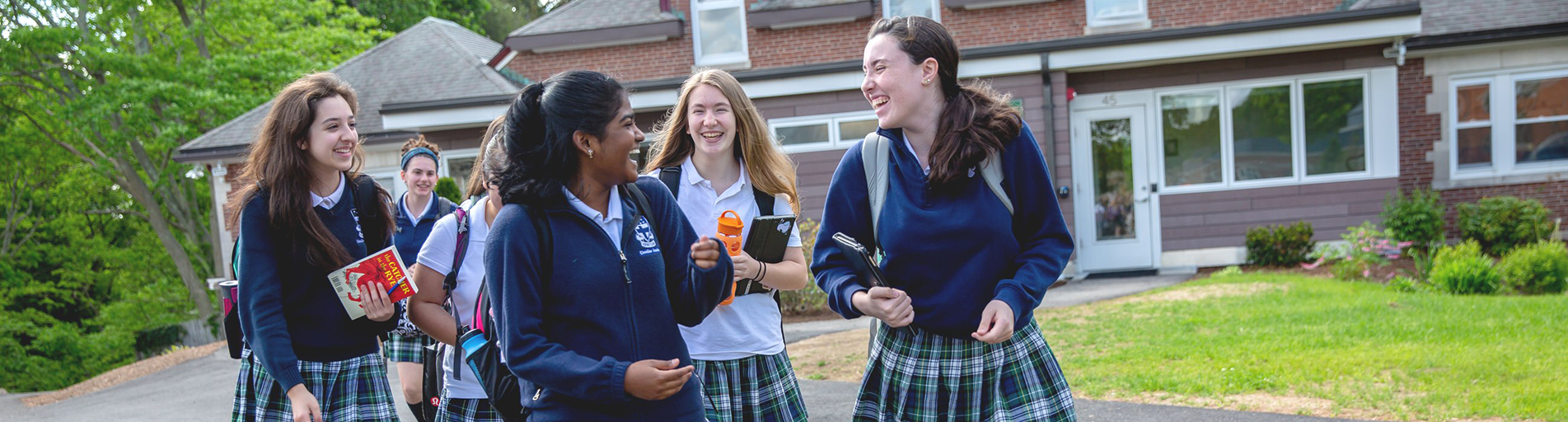 students walking on campus grounds